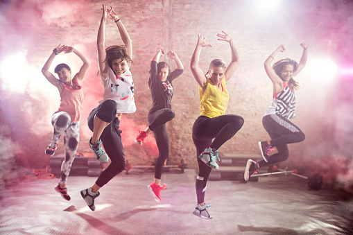 Group of fit young women dancing  and exercising